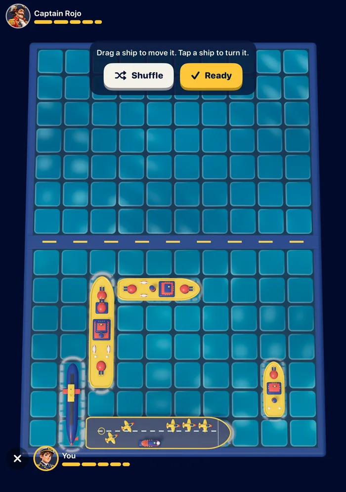 Peekaboard fleet placement on the iPhone Duo inner display: toy ships on the lower half of a turquoise grid, with Shuffle and Ready buttons