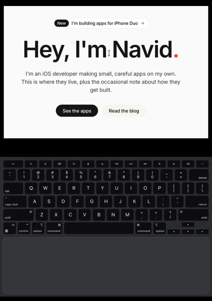 Uplid on the iPhone Duo inner screen: the Mac picture zoomed in on a web page headline at the pointer