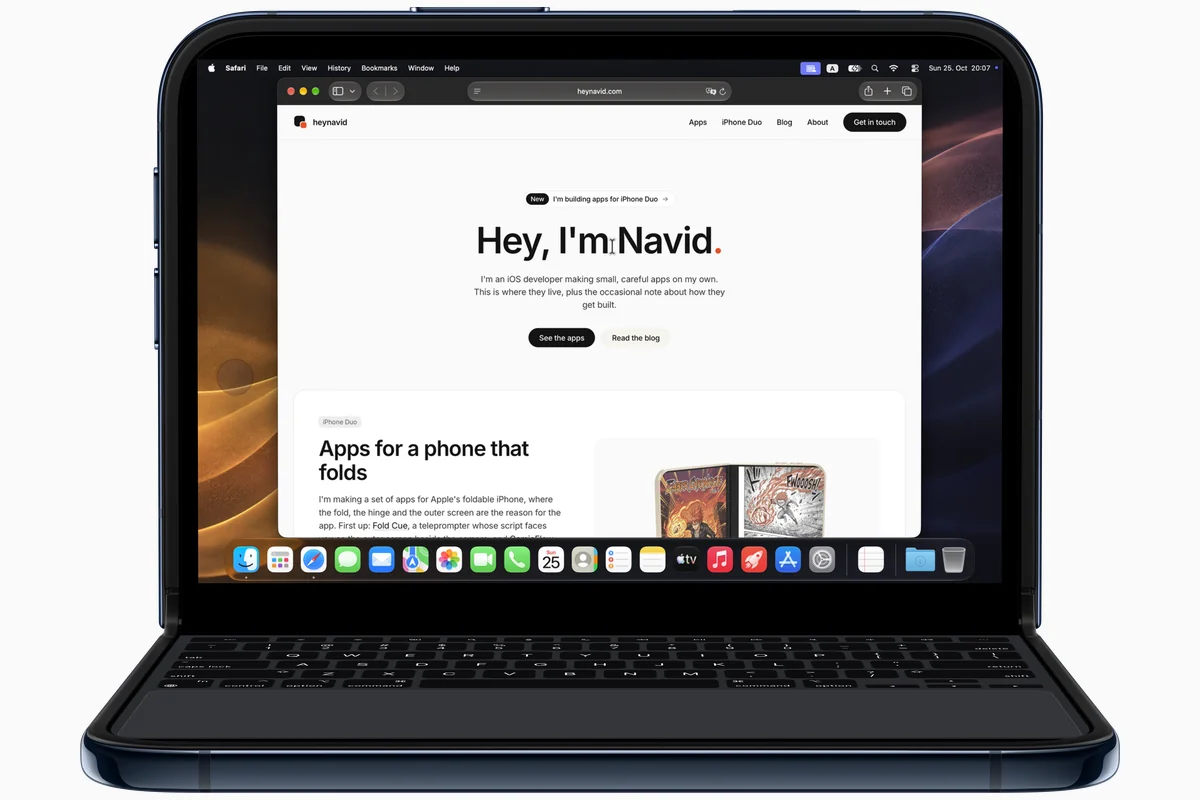iPhone Duo standing in laptop pose with Uplid open: a Mac desktop with Safari on the top half, and a Mac keyboard and trackpad on the bottom half. Apple's product image of the Duo with a real Uplid screen